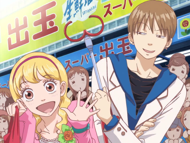 A cute petite blond girl smiles while a boy holds a grabbing tool with a menacing grin on his face.